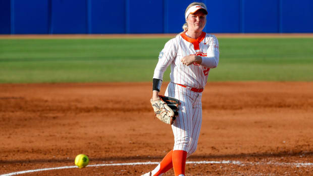 Oklahoma State pitcher Kelly Maxwell (28) pitches during a softball game between Oklahoma State (OSU) and Tennessee at the Women's College World Series at USA Softball Hall of Fame Stadium in Oklahoma City on Sunday, June 4, 2023.